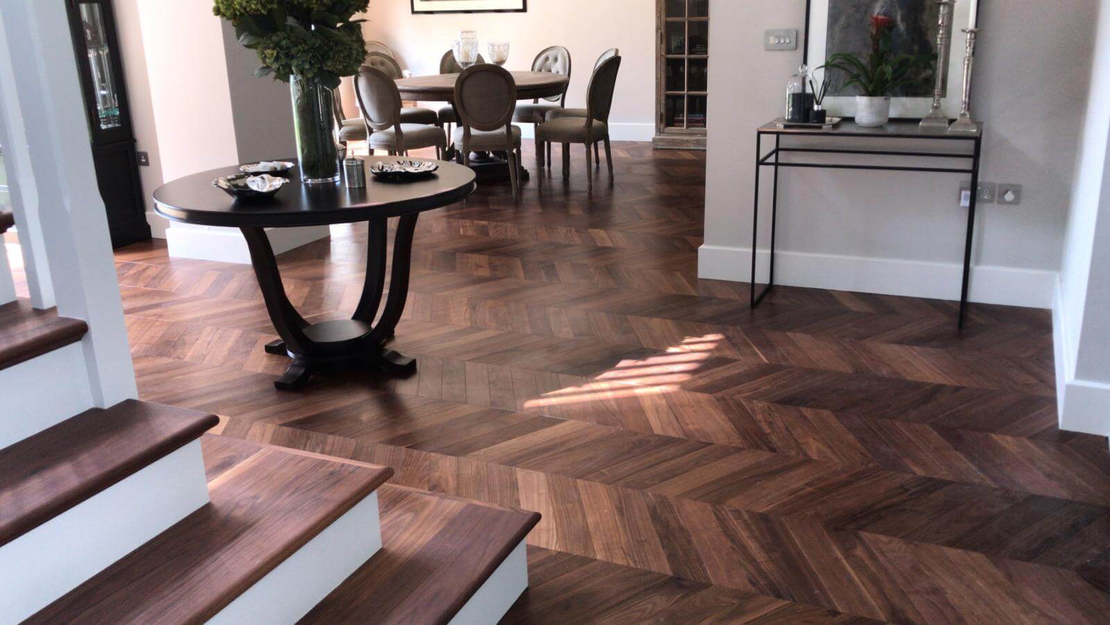 Living Room With Walnut Flooring And White Walls